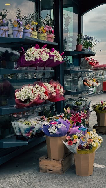 A display of various floral arrangements and bouquets at chasecrossflowers.co.uk, showcasing fresh flowers in vibrant pinks, whites, purples, and yellows. Flowers include chrysanthemums, lilies, roses